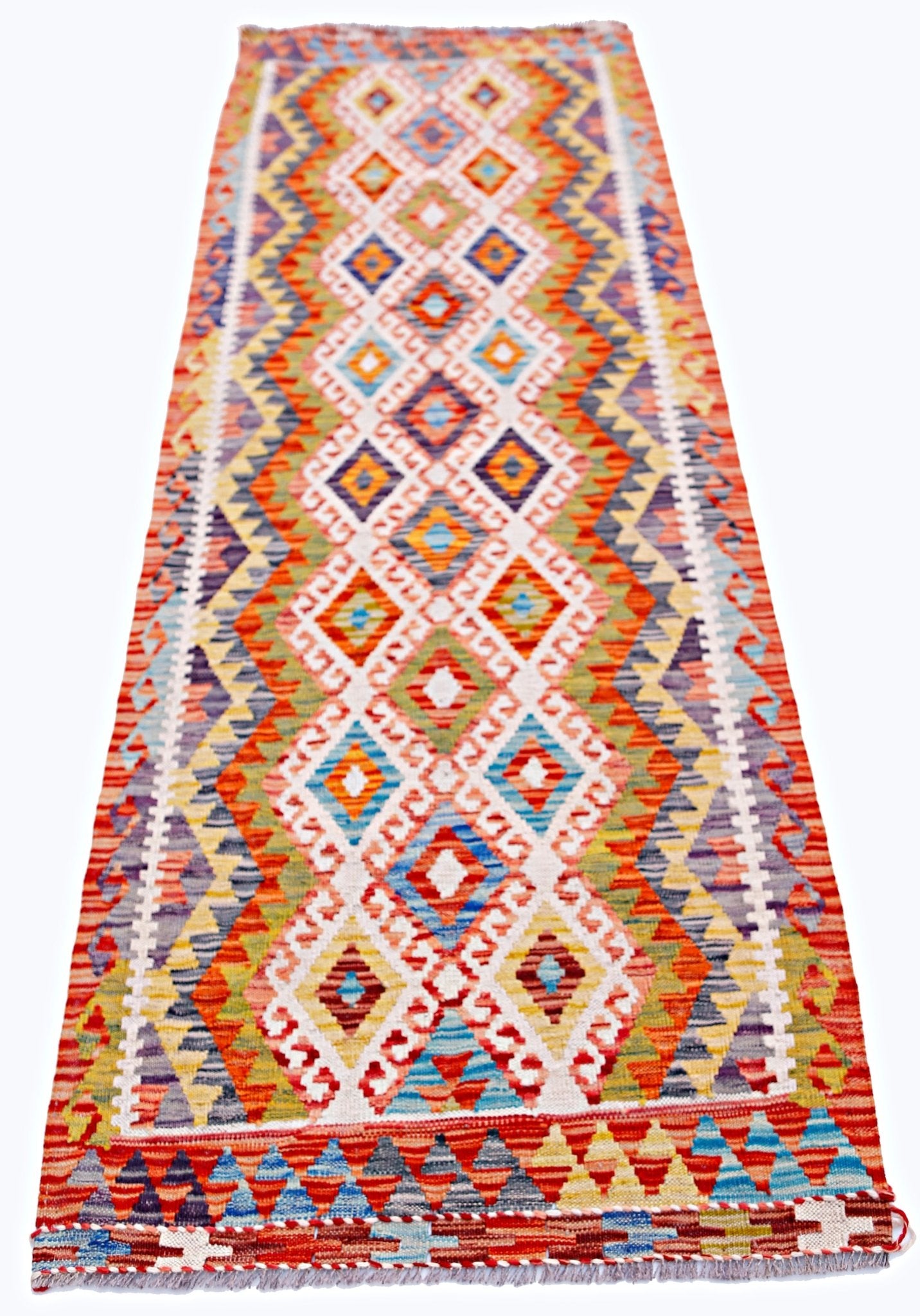 Handwoven Afghan Maimana wool runner featuring a vibrant geometric diamond pattern.