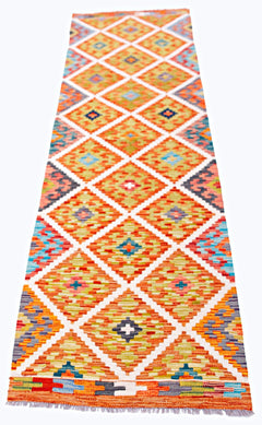 Handwoven Afghan Maimana wool runner featuring a colorful geometric diamond pattern.