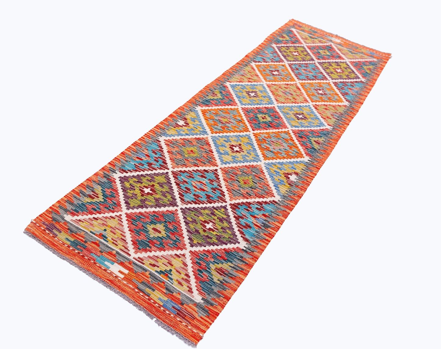 Handwoven Afghan Maimana wool runner rug featuring a colorful geometric diamond pattern.