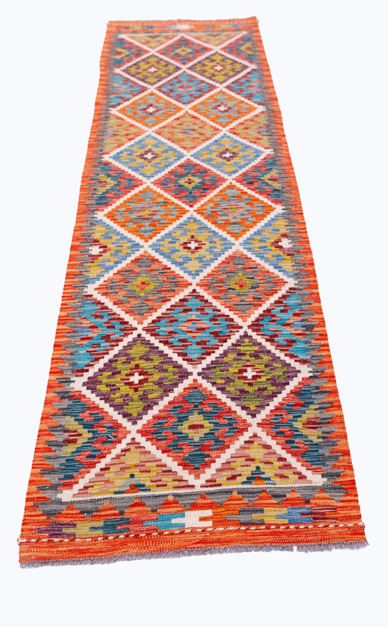 Handwoven Afghan Maimana wool runner featuring a vibrant geometric diamond pattern.