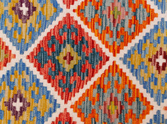 Handwoven Afghan Maimana kilim runner featuring a vibrant geometric diamond pattern in wool.