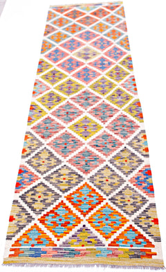 Handwoven Afghan Maimana wool runner featuring a colorful geometric diamond pattern.