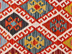 Handwoven Afghan Maimana kilim runner featuring a vibrant geometric diamond pattern in wool.