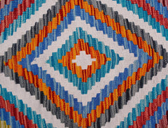 A handmade Afghan Maimana kilim runner featuring a vibrant geometric diamond pattern in wool.
