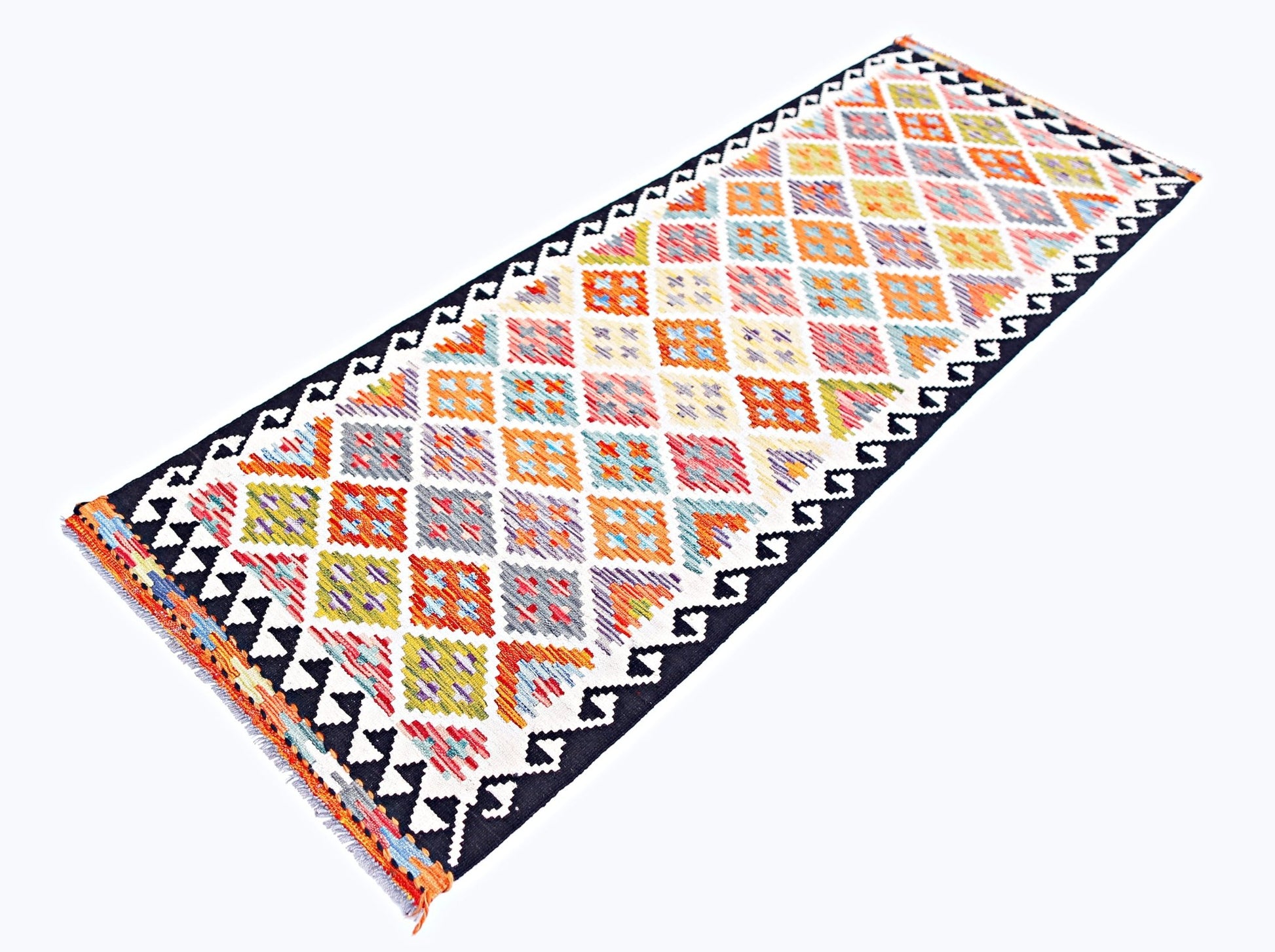 Handwoven Afghan Maimana wool runner featuring a colorful diamond pattern and black zigzag borders.