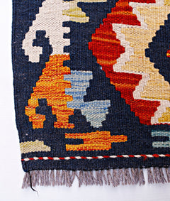 Handwoven Afghan Maimana wool kilim runner featuring geometric patterns in blue, red, and yellow.