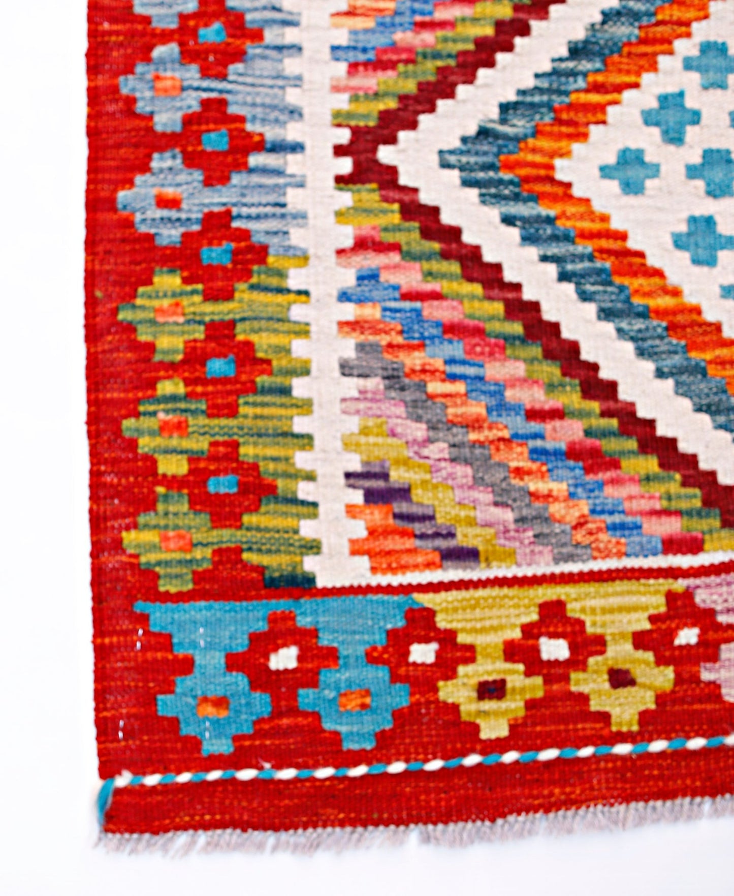 Handwoven Afghan Maimana wool runner featuring a vibrant geometric pattern in red and multi-colors.