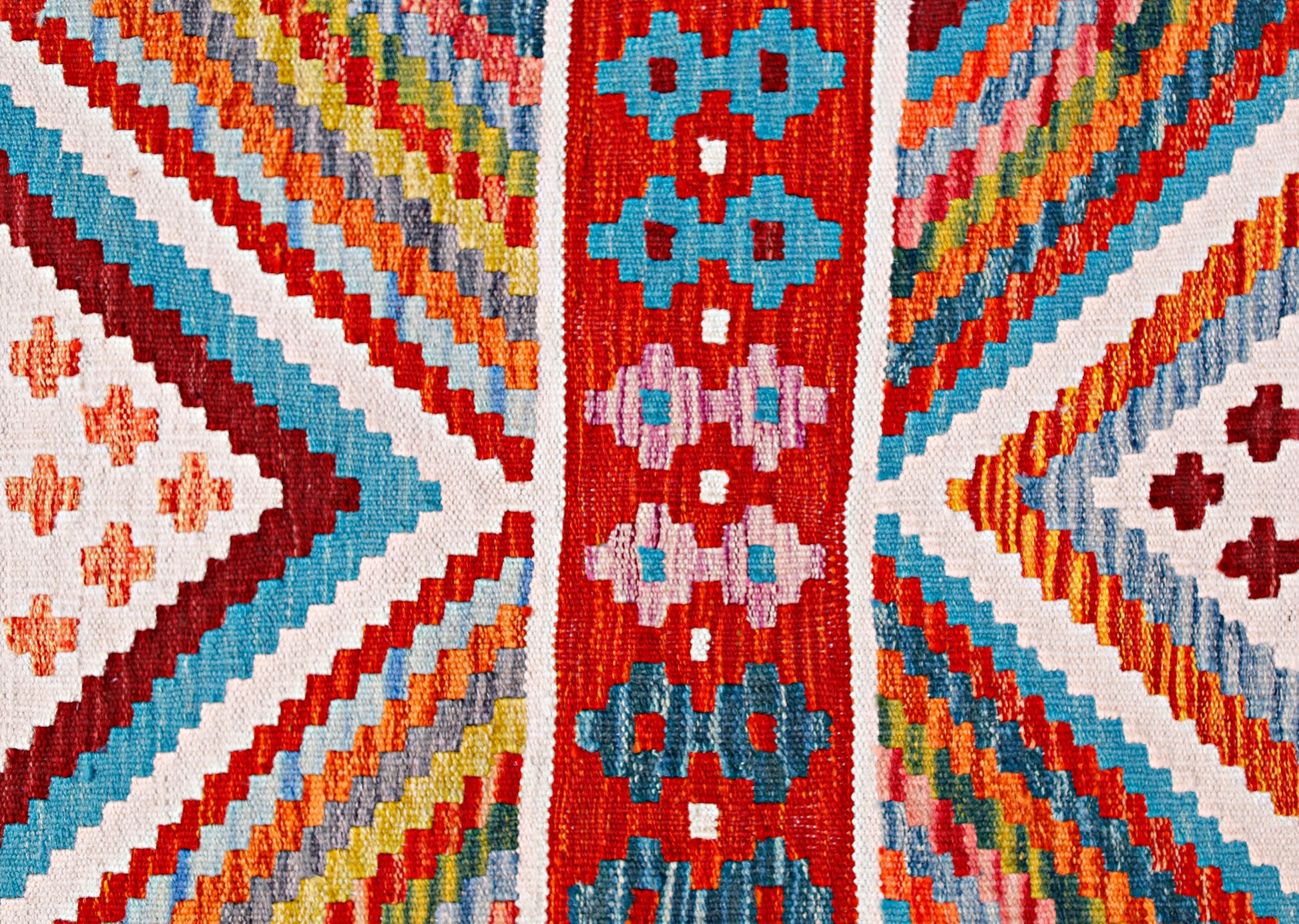 Handwoven Afghan Maimana wool runner featuring a vibrant geometric pattern in a flatweave style.