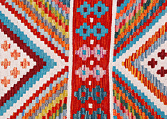 Handwoven Afghan Maimana wool runner featuring a vibrant geometric pattern in a flatweave style.