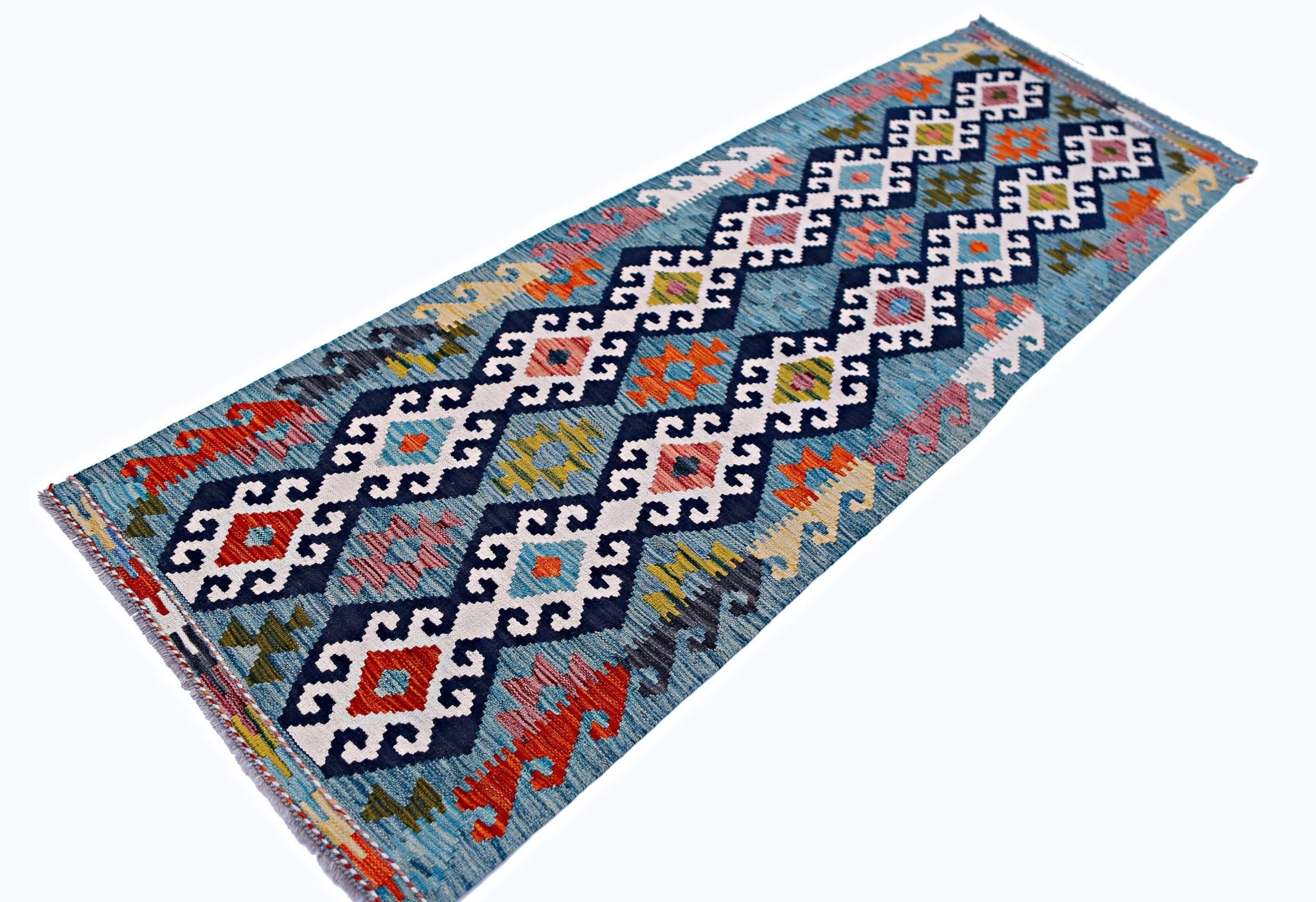 An Afghan Maimana Kilim runner featuring a blue background with colorful geometric diamond patterns.
