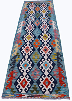 Handwoven Afghan Maimana wool runner rug featuring a blue background with geometric patterns.