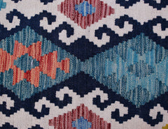 Handwoven Afghan Maimana kilim runner featuring a geometric pattern in blue, red, and cream wool.