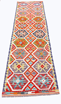 Handwoven Afghan Maimana wool runner featuring a vibrant geometric diamond pattern.