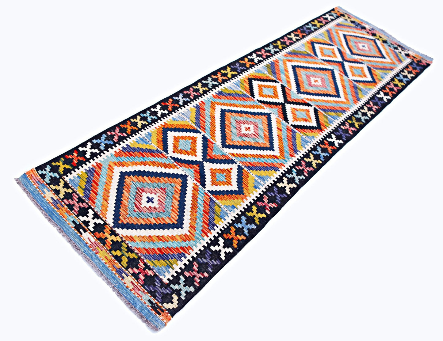 A handmade Afghan Maimana wool runner rug featuring a vibrant geometric diamond pattern.