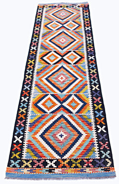 Handwoven Afghan Maimana wool runner featuring a vibrant geometric diamond pattern.