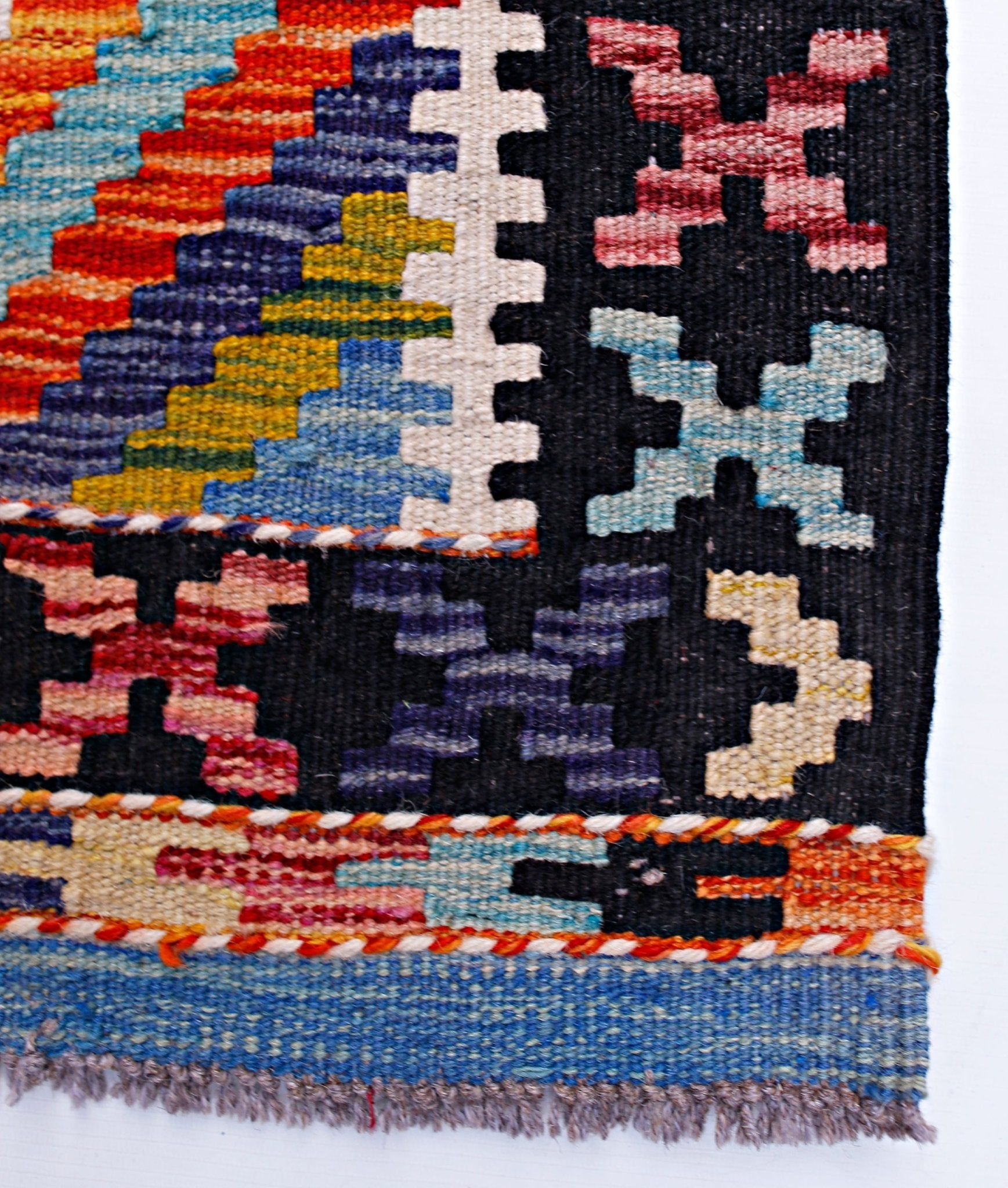 Handwoven Afghan Maimana wool kilim runner featuring vibrant geometric patterns and fringe edges.