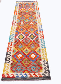 Handwoven Afghan Maimana wool runner featuring a colorful geometric diamond pattern.