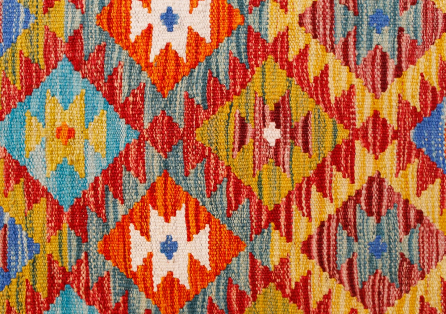 Handwoven Afghan Maimana kilim runner featuring a vibrant geometric diamond pattern in wool.