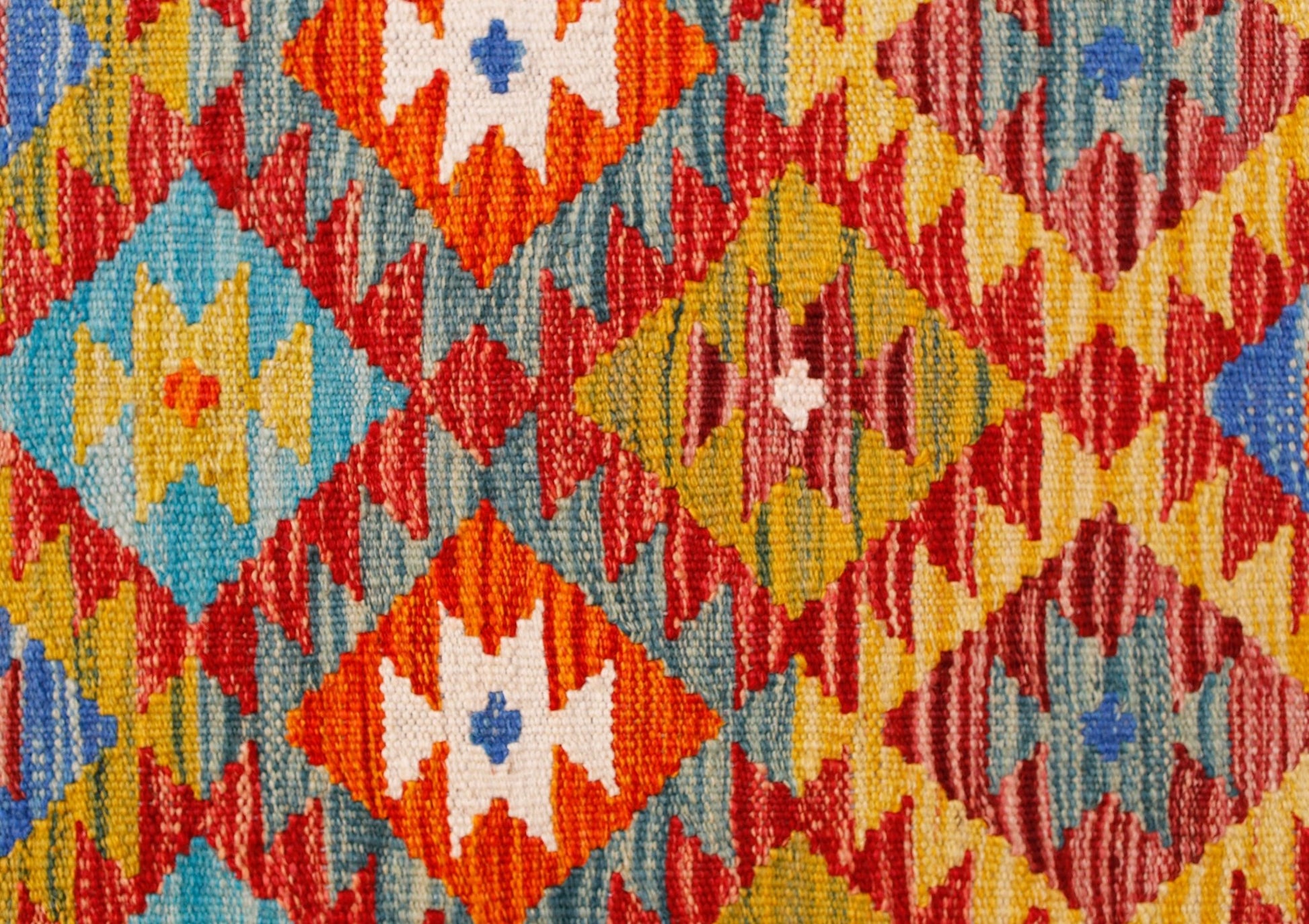 Handwoven Afghan Maimana kilim runner featuring a vibrant geometric diamond pattern in wool.