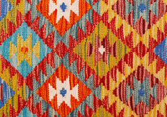 Handwoven Afghan Maimana kilim runner featuring a vibrant geometric diamond pattern in wool.