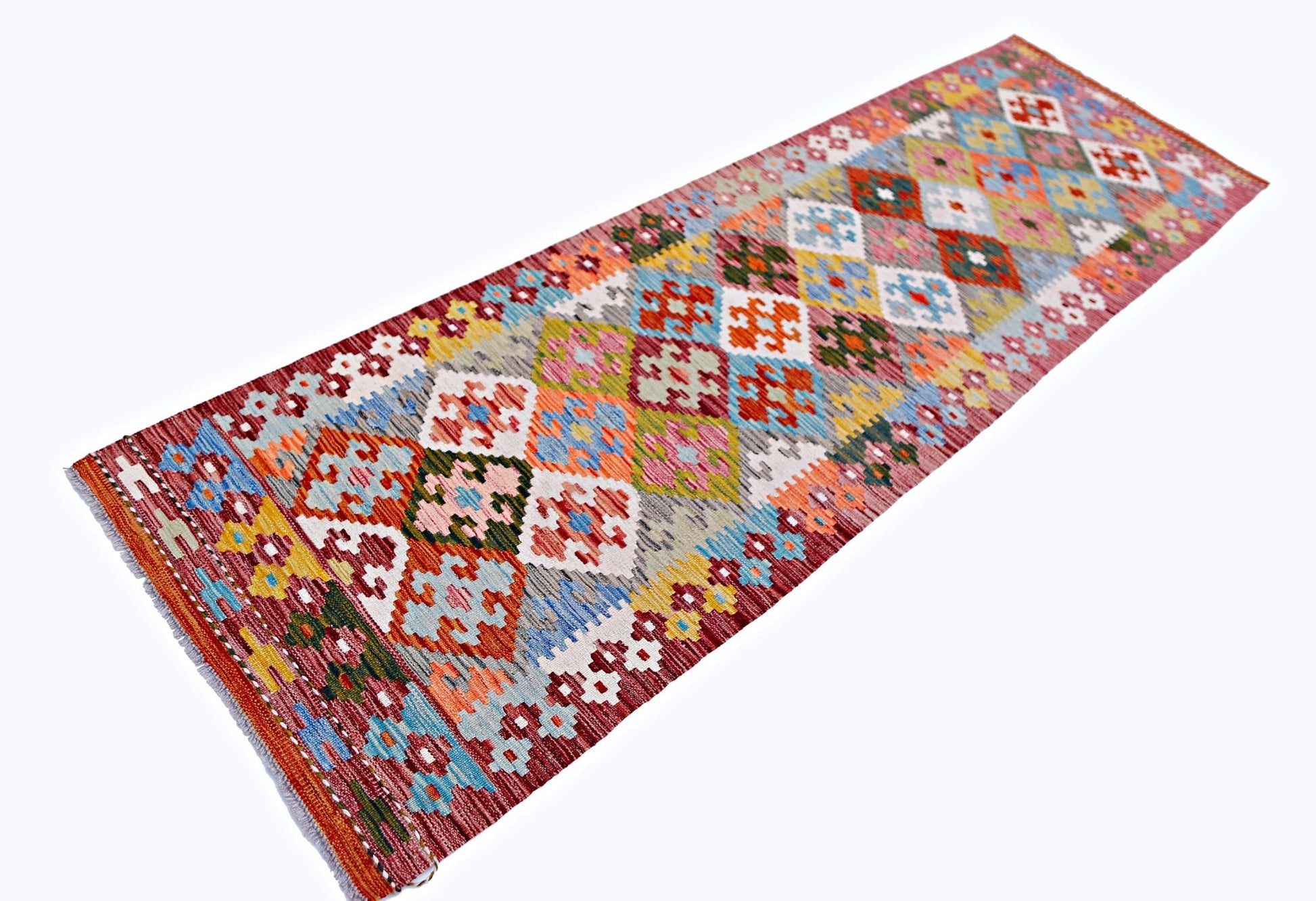 Handwoven Afghan Maimana wool runner rug featuring a colorful geometric diamond pattern.