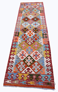 Handwoven Afghan Maimana wool runner featuring a colorful geometric diamond pattern.