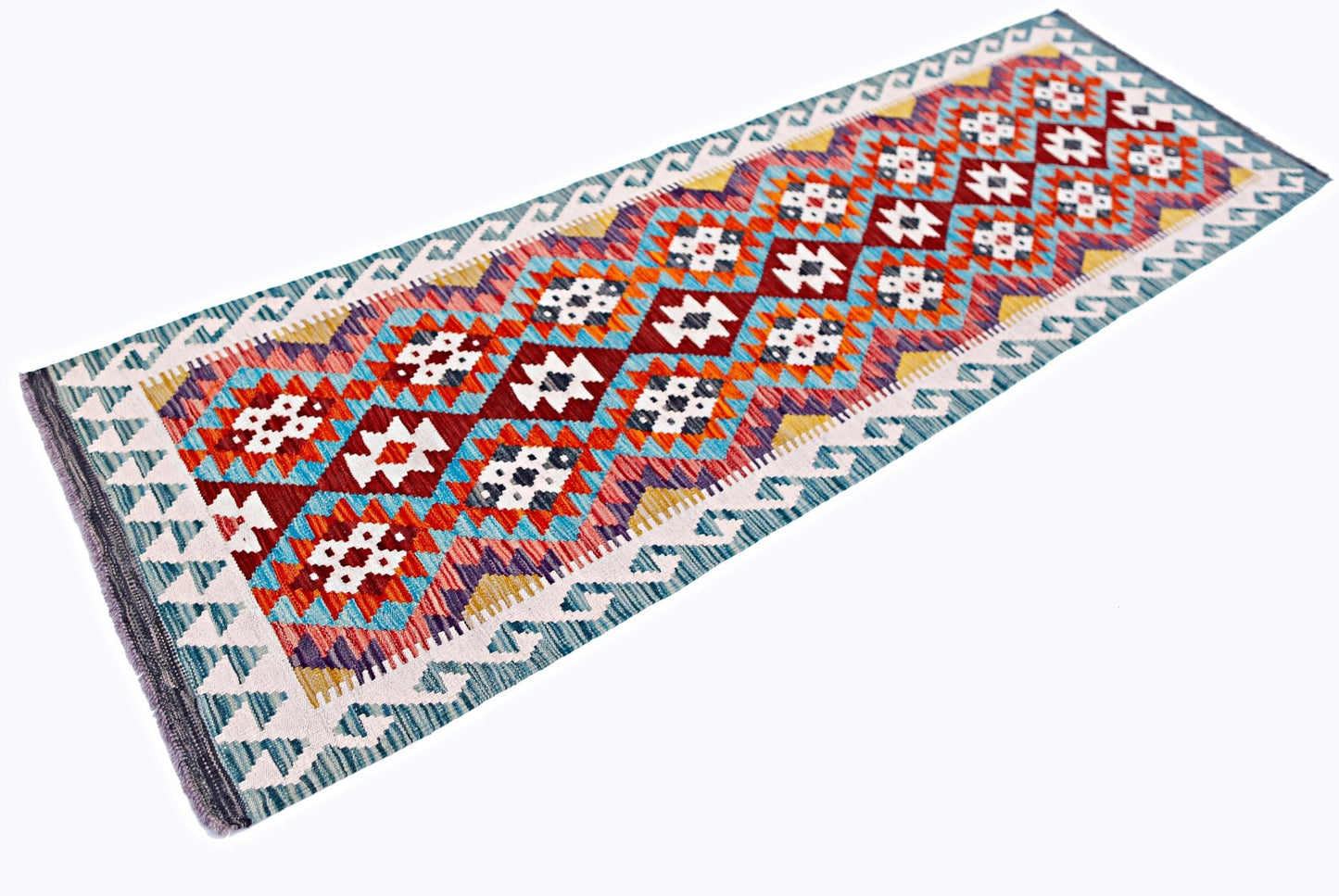 Handwoven Afghan Maimana wool runner rug featuring a colorful geometric diamond pattern.