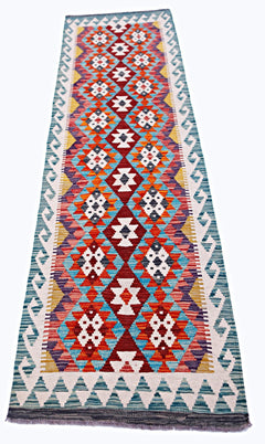 Handwoven Afghan Maimana wool runner rug featuring a vibrant geometric diamond pattern.