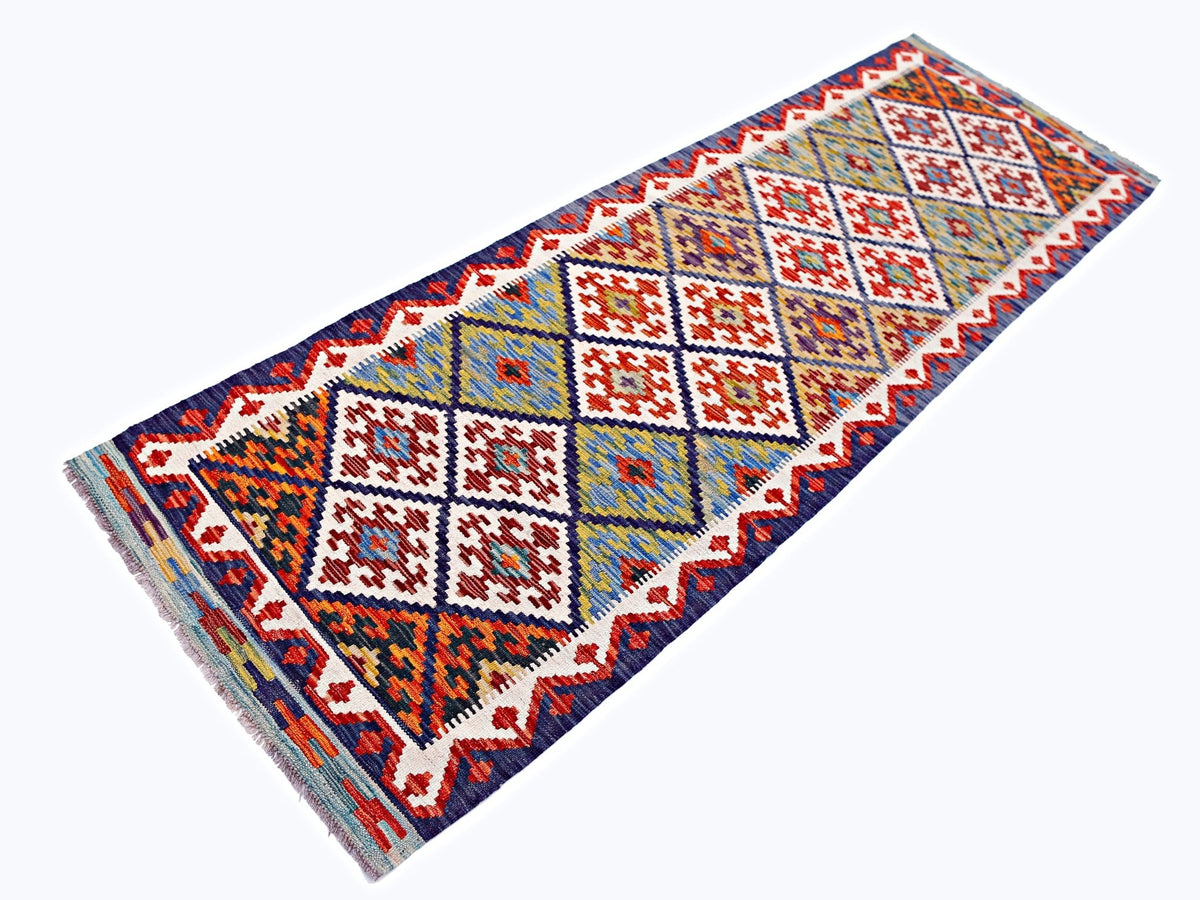 Handwoven Afghan Maimana wool runner rug featuring a colorful geometric diamond pattern.