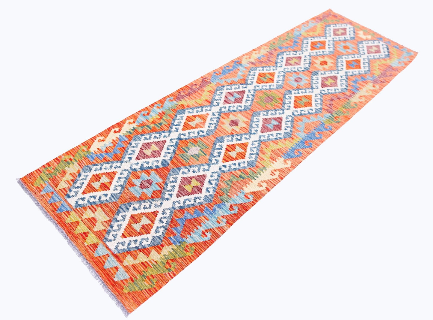 Handwoven Afghan Maimana wool runner featuring a vibrant orange background and geometric patterns.