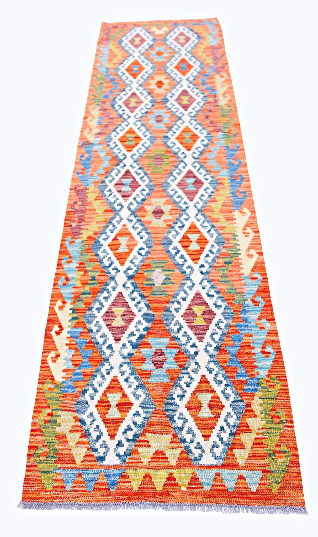 Handwoven Afghan Maimana wool runner featuring a vibrant orange background and geometric patterns.