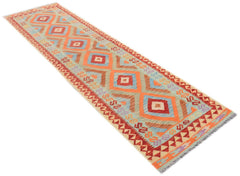 Handmade Afghan Maimana kilim runner featuring a geometric diamond pattern in vibrant colors.