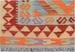 A handmade Afghan Maimana kilim runner featuring geometric patterns in vibrant, multicolored wool.