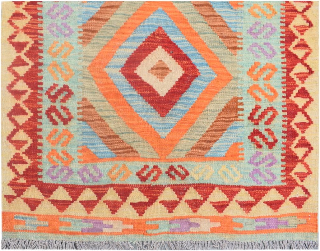 Handmade Afghan Maimana kilim runner featuring a vibrant geometric diamond pattern in wool.
