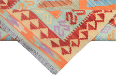 A handmade Afghan Maimana kilim runner featuring vibrant geometric patterns in wool.