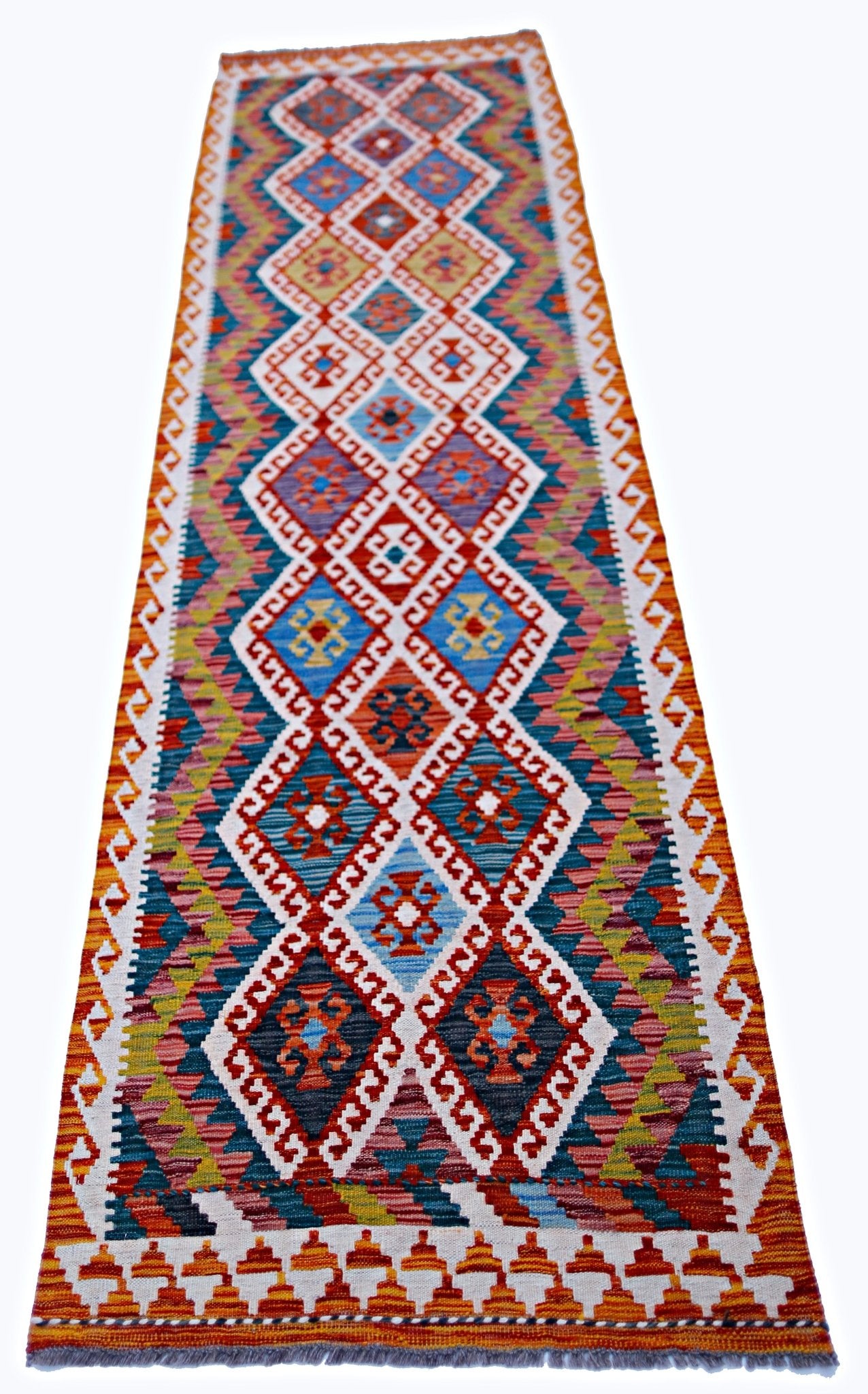 A handmade Afghan Maimana wool runner rug featuring a colorful geometric diamond pattern.