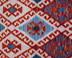 Handwoven Afghan Maimana kilim runner featuring a geometric diamond pattern in vibrant colors.