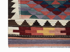 Handwoven Afghan Maimana wool kilim runner featuring a geometric pattern in earthy tones.