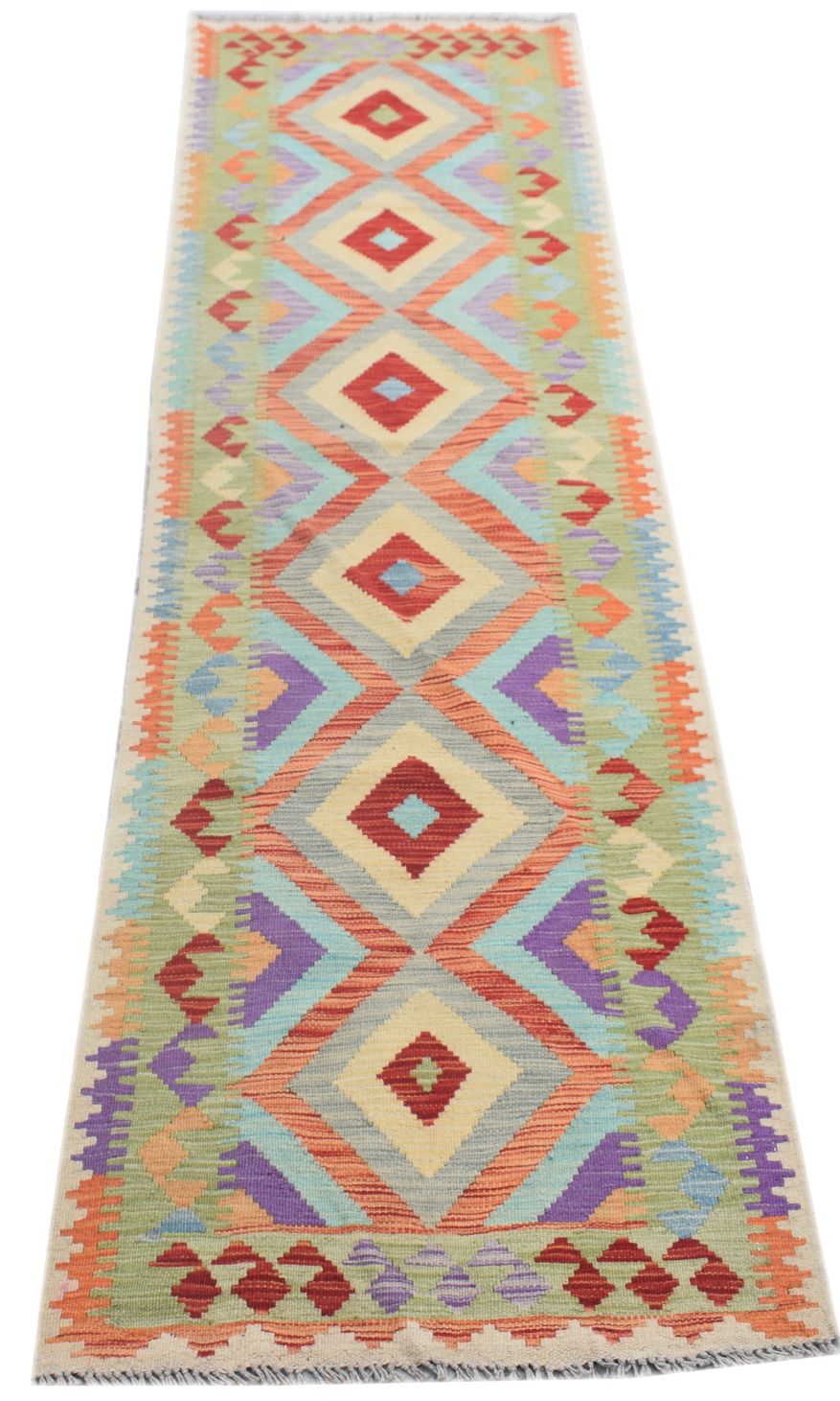 Handmade Afghan Maimana wool runner rug featuring a colorful geometric diamond pattern.