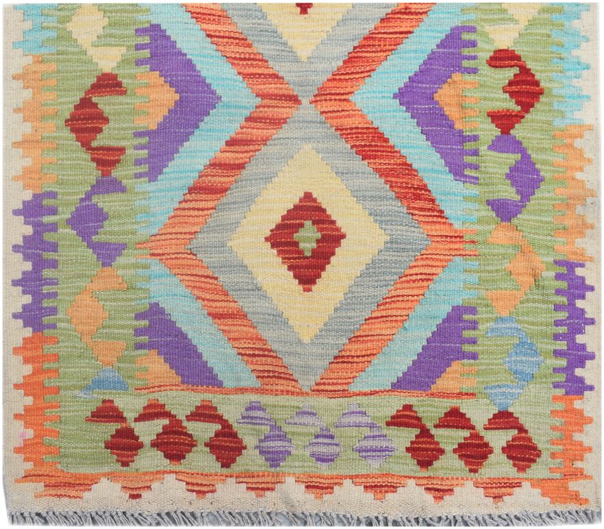 Handmade Afghan Maimana wool runner rug featuring a vibrant geometric diamond pattern.