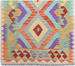 Handmade Afghan Maimana wool runner rug featuring a vibrant geometric diamond pattern.