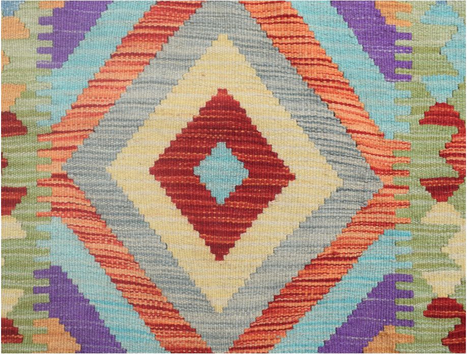 Handmade Afghan Maimana wool runner rug featuring a vibrant geometric diamond pattern.
