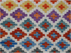 Handwoven Afghan Maimana kilim runner featuring a repeating geometric diamond pattern in wool.