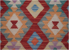 Handmade Afghan Maimana kilim runner featuring a vibrant geometric diamond pattern in wool.
