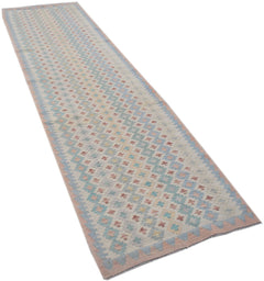 Handmade Afghan Maimana kilim runner featuring a geometric pattern in soft pastel tones.
