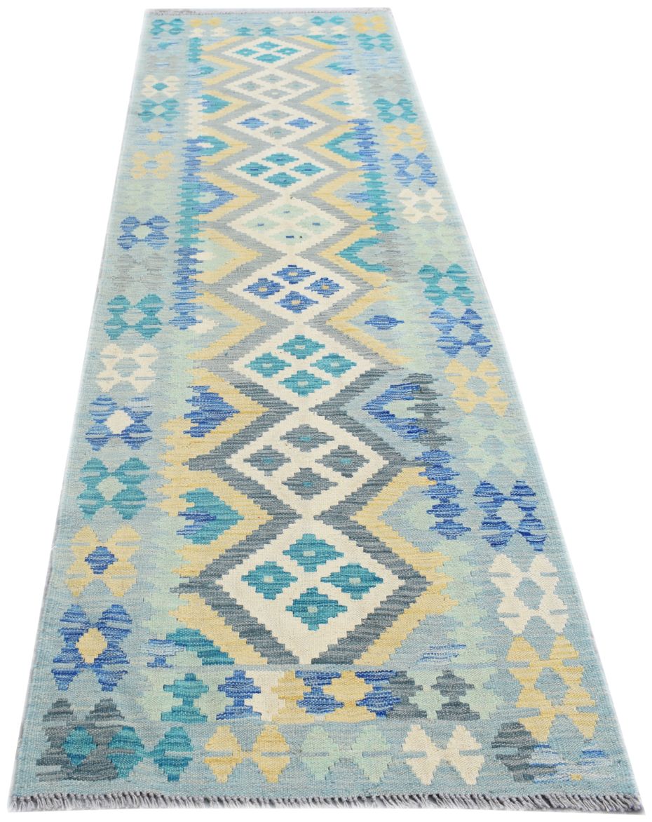 Handmade Afghan Maimana wool runner rug featuring a geometric diamond pattern in blue and yellow.