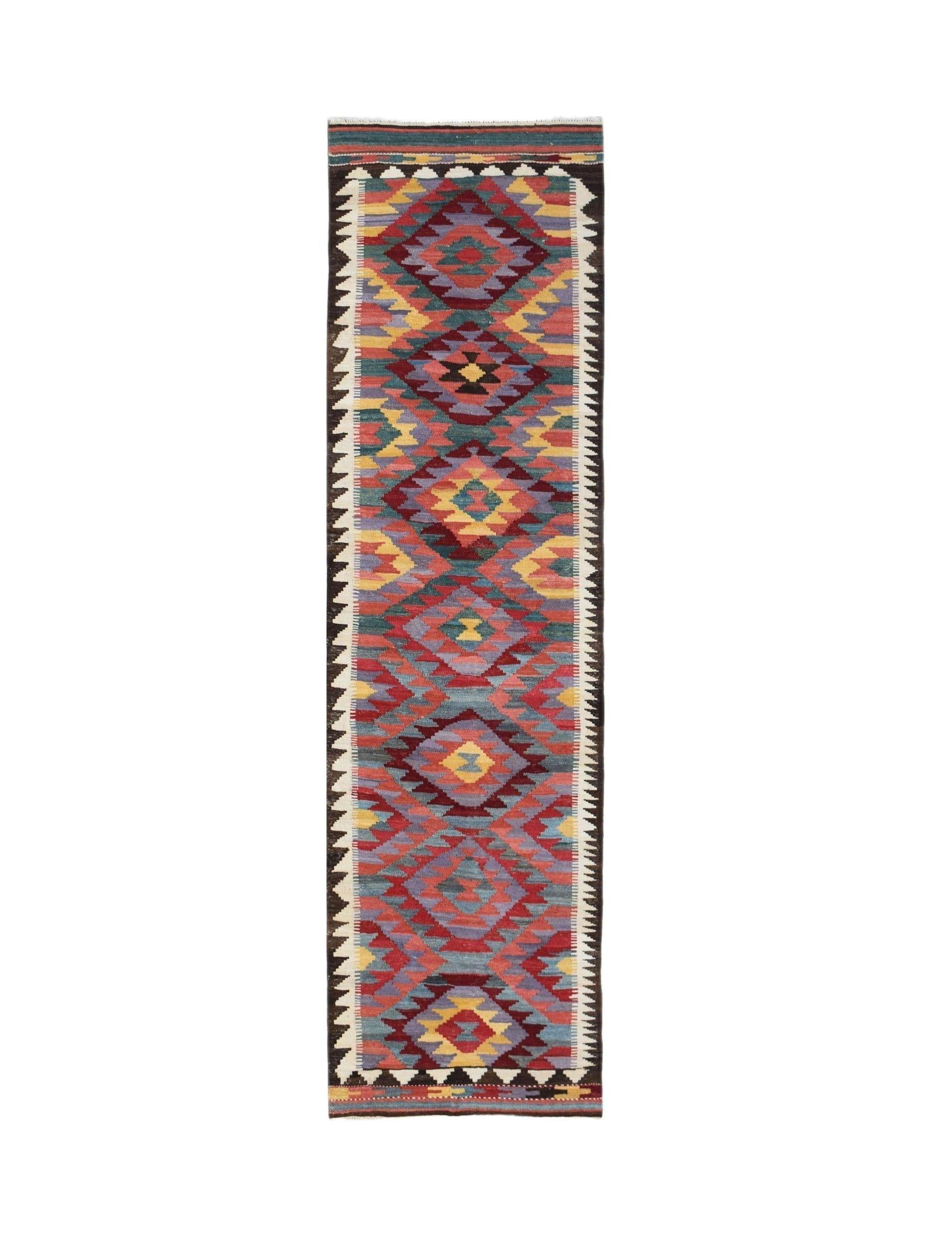 Handwoven Afghan Maimana wool runner rug featuring a colorful geometric diamond pattern.