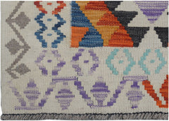 Handmade Afghan Maimana kilim runner featuring colorful geometric patterns on a cream background.