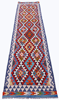Handwoven Afghan Maimana wool runner featuring a vibrant, multicolored geometric diamond pattern.