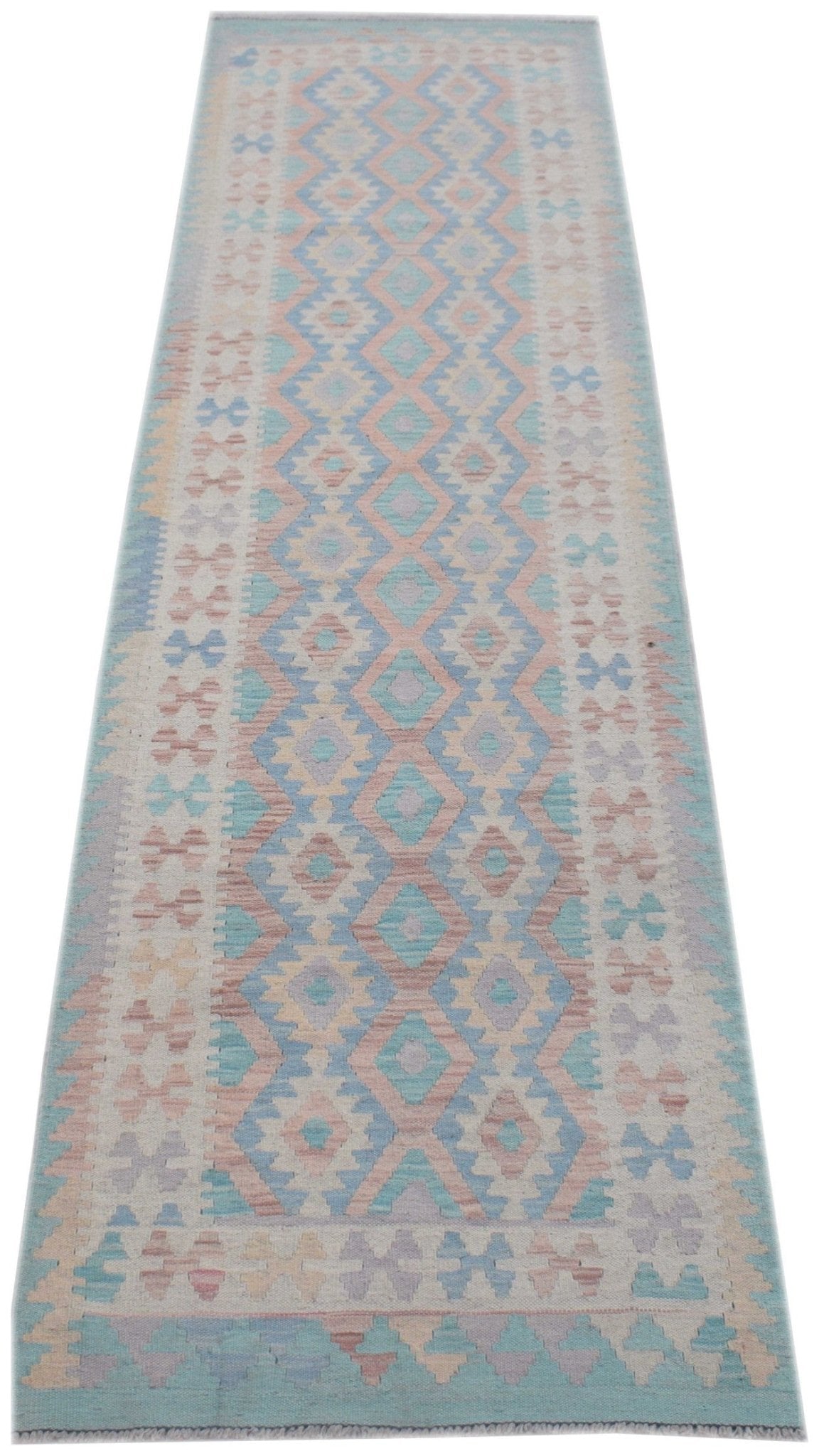 Handmade Afghan Maimana wool runner rug featuring a geometric diamond pattern in pastel colors.